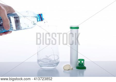 Pour Water Into A Glass. Water And Tablets. Bottle Of Water In Hand. Isolate.