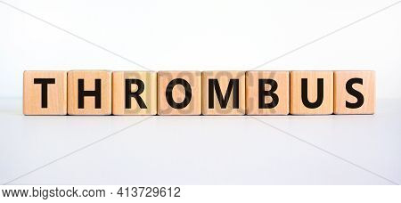Medical And And Thrombus Symbol. Wooden Cubes With The Word 'thrombus'. Beautiful White Background. 
