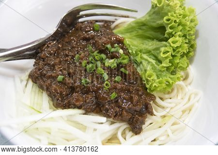 Zha Jiang Mian, Chinese Cuisine, Noodles Topped With Fermneted Soy Bean Paste And Fresh Vegetable