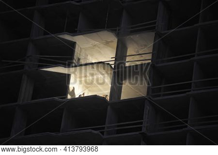 House Under Construction In The Evening With A Luminous Opening