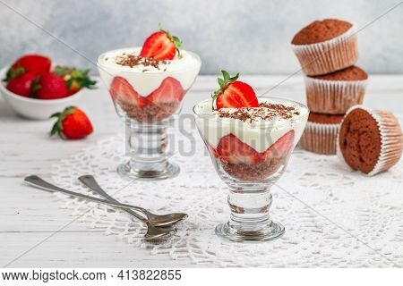 Trifle. Layered Dessert Of Chocolate Sponge Cake, Whipped Cream Or Ricotta And Fresh Strawberries In