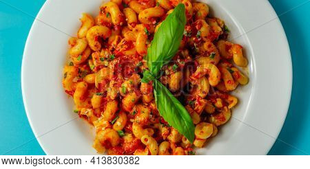 Cooked Cellentani Pasta With Cooked Chicken Breast And Peppers In A Spicy Tomato And Jalapeno Dressi