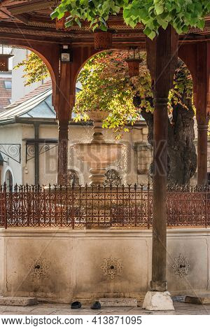 Beautiful fountain Sadrvan located in the courtyard of Gazi Husrev Begova Mosque with an ornate wooden ceiling in Sarajevo, Bosnia and Herzegovina