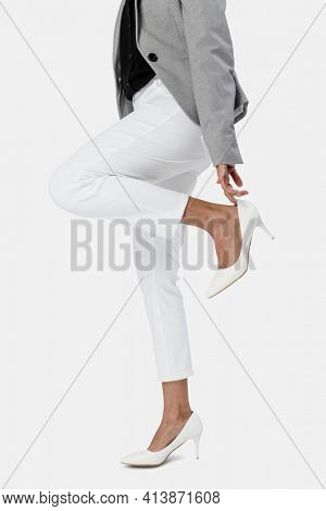 Businesswoman wearing her white high heel
