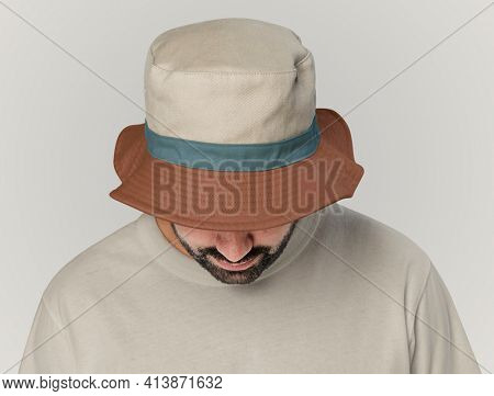 Man wearing bucket hat with minimal design