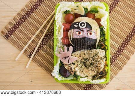 The Warrior Is Made Of Rice. Kyaraben, Bento
The Fighter Is Dressed In A Mask And Bandana. Creative 