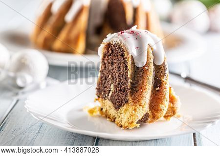 A Cut Piece Of Easter Marble Cake On A White Plate