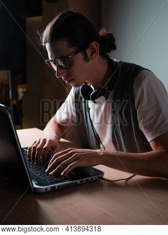 Write Code And Learn Programming Languages. A Student Or Specialist Is Doing A Project.