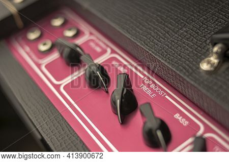 Close-up Of The Knobs Of A Classic Rock And Roll Music Amplifier, With Regulators For Volume, Bass A
