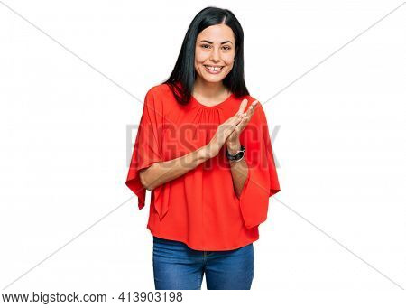 Beautiful young woman wearing casual clothes clapping and applauding happy and joyful, smiling proud hands together 