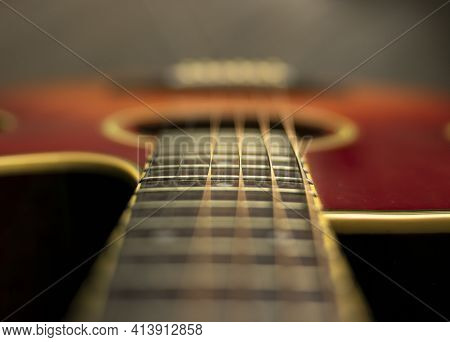 Shot From The Neck Of The Acoustic Guitar With Focus On The Fifteenth Fret
