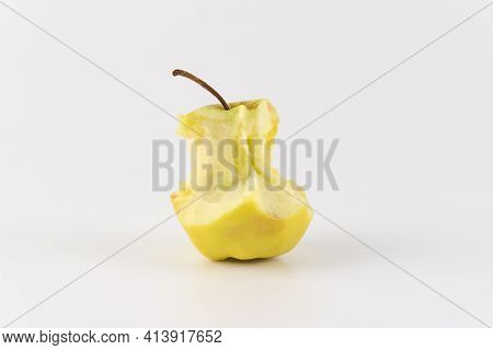 Golden Green Delicious Bitten Apple Isolated On White. An Apple Stub.