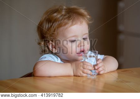 Healthy Nutrition For Kids. Baby Drink Water. Portrait Of A Sweet Beautiful Child Drinking A Glass O
