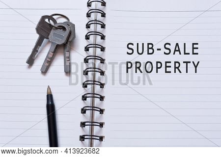Text Written On Notebook With House Keys And Pen - Sub-sale Property