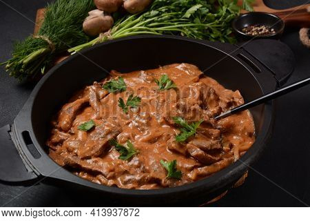 Beef Stroganoff With Cremini And Champignons On A Frying Pan.