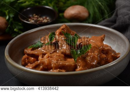Traditional Beef Stroganoff In A Ceramic Bowl With Mashed Potato