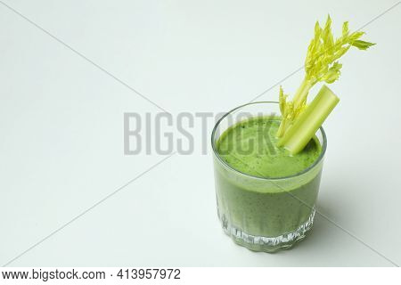 Glass Of Green Smoothie With сelery On White Background