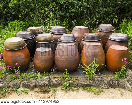 Jangdok Or Traditional Korean Pots For Ferment Kimchi, Red Pepper Paste And Soybeans, Close Up Image