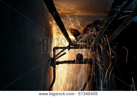 Professional Welder Cutting And Grinding Metallic Pipes