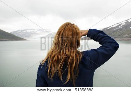 Woman Looking At A Glacier