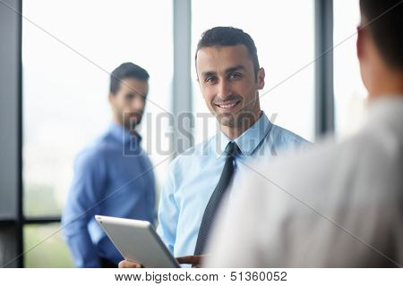 close-up of human hand  business man using tablet compuer at office