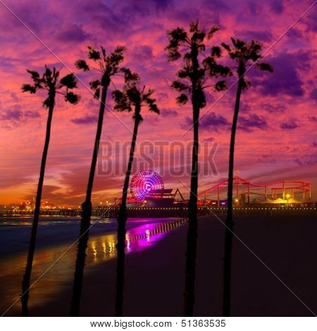 Santa Monica California sunset on Pier Ferrys wheel and reflection on beach wet sand photo illustration