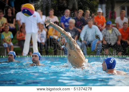 KAPOSVAR, HUNGARY - SEPTEMBER 15: Farkas Dory (7) in action at a Hungarian championship water-polo game between Kaposvar (white) and Honved (blue) on September 15, 2013 in Kaposvar, Hungary
