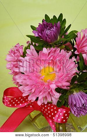 .bouquet Of Pink Asters In A Glass Vase