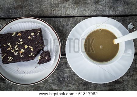 coffee with brownies on wood table