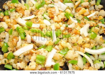Frying Poatoes, Onions And Green Peppers
