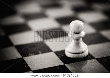 White Chess Pawn Standing On Chessboard