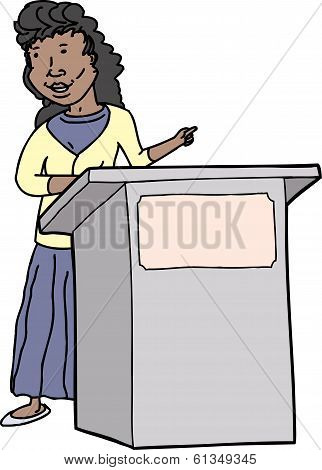 Woman Speaking At Lectern