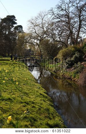 HEVER CASTLE AND GARDENS, KENT, UK - MARCH 10, 2014: River in 250 acre park. 13th century  Tudor man