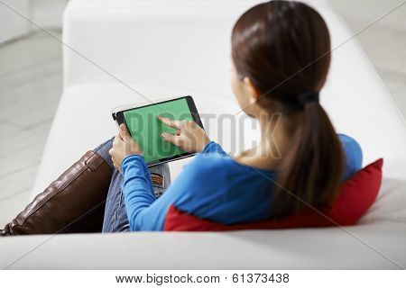 Asian Girl Using Touch Pad Device
