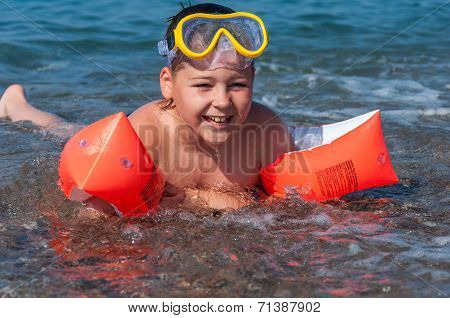 Boy Learning To Swim With Oversleeves