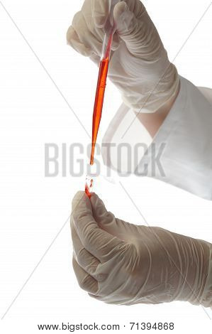 Hand With Pipette And Testtube Isolated On White