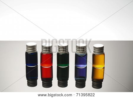 Colorful Vials Isolated On Black Background