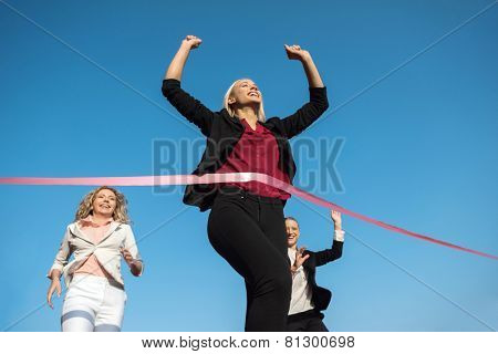 business people running together on racing track