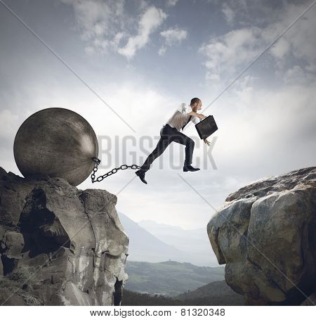 Businessman jumps the obstacle