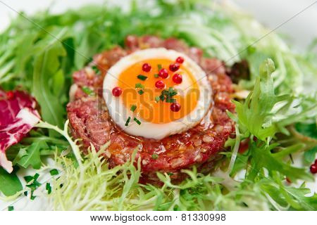 Beef tartare in plate, close-up