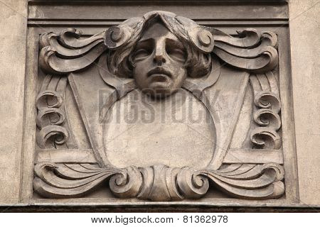 Floral ornamental decoration and mascaron on the the Art Nouveau building in Prague, Czech Republic.