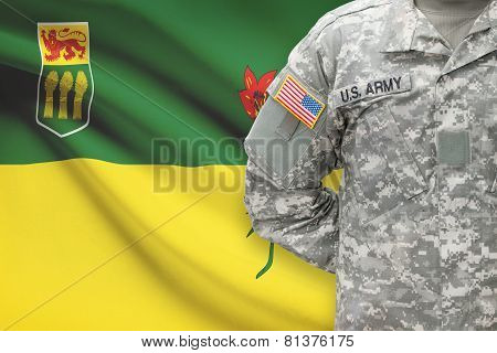 American Soldier With Canadian Province Flag On Background - Saskatchewan