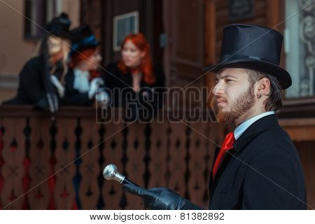 Man With A Cane And Three Girls.