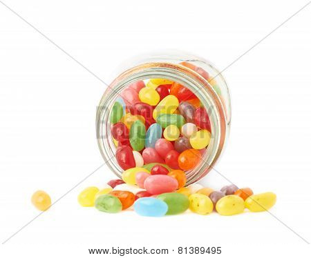 Jelly bean candies spilled out of jar