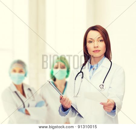 healthcare and medicine concept - calm female doctor with clipboard and stethoscope