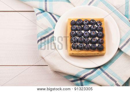 Tartlet with bluebarries and custard