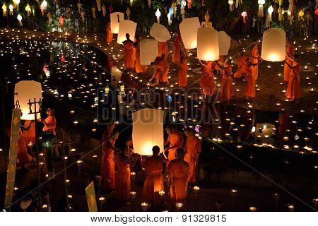 Thai monk with light lantern