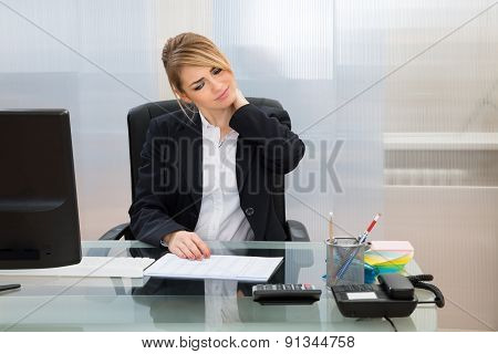 Young Businesswoman Suffering From Neckache