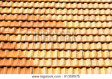 bright sunlight lit roof top tiles background
