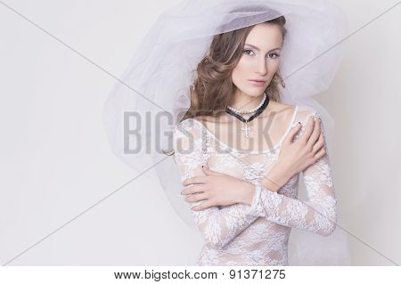 Brunette Bide Innocent Nun Woman In Lace Dress With A Veil With A Cross Accessories, All Wearing Whi